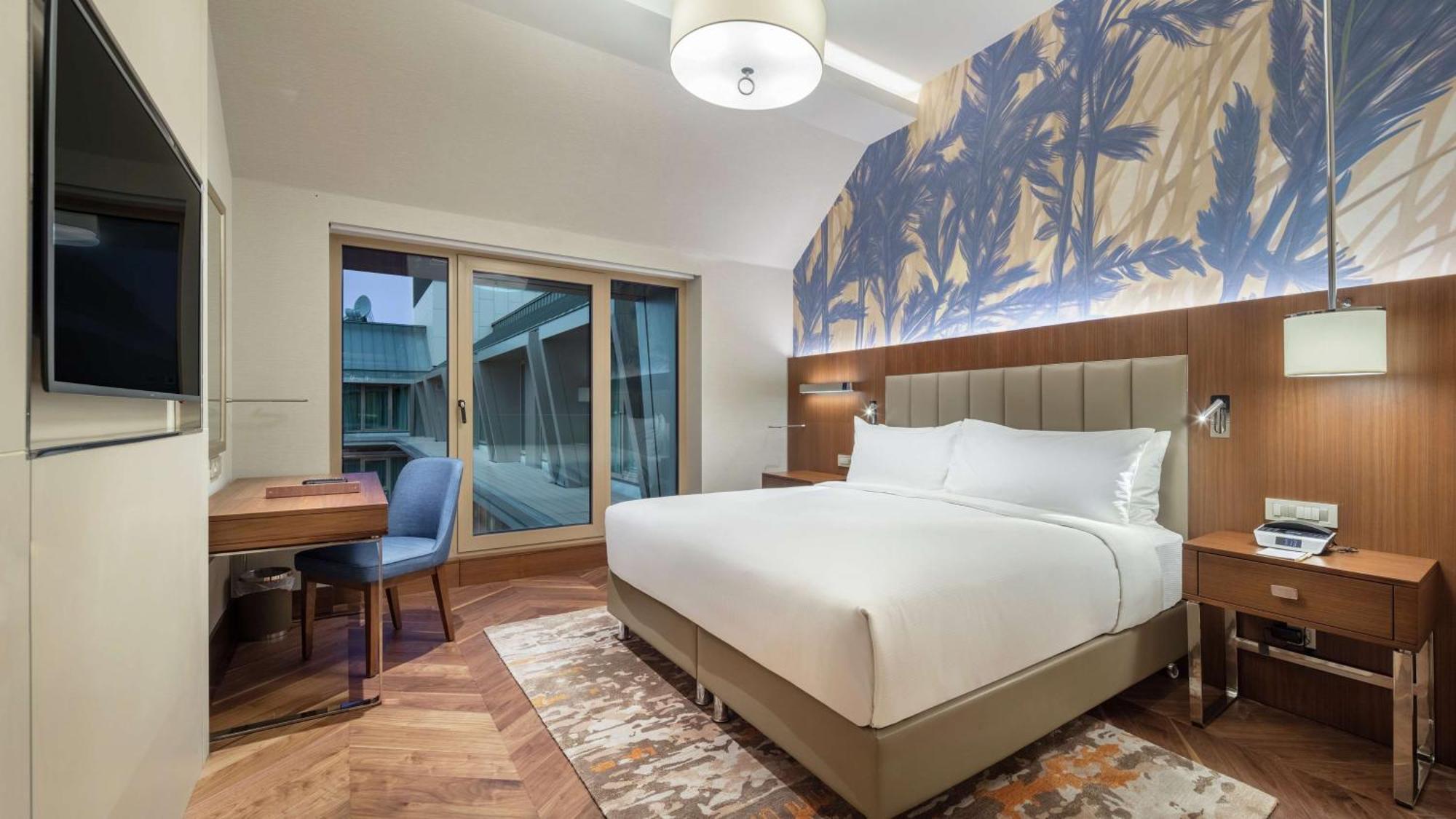Doubletree By Hilton Skopje Hotel Bagian luar foto A bedroom at the hotel